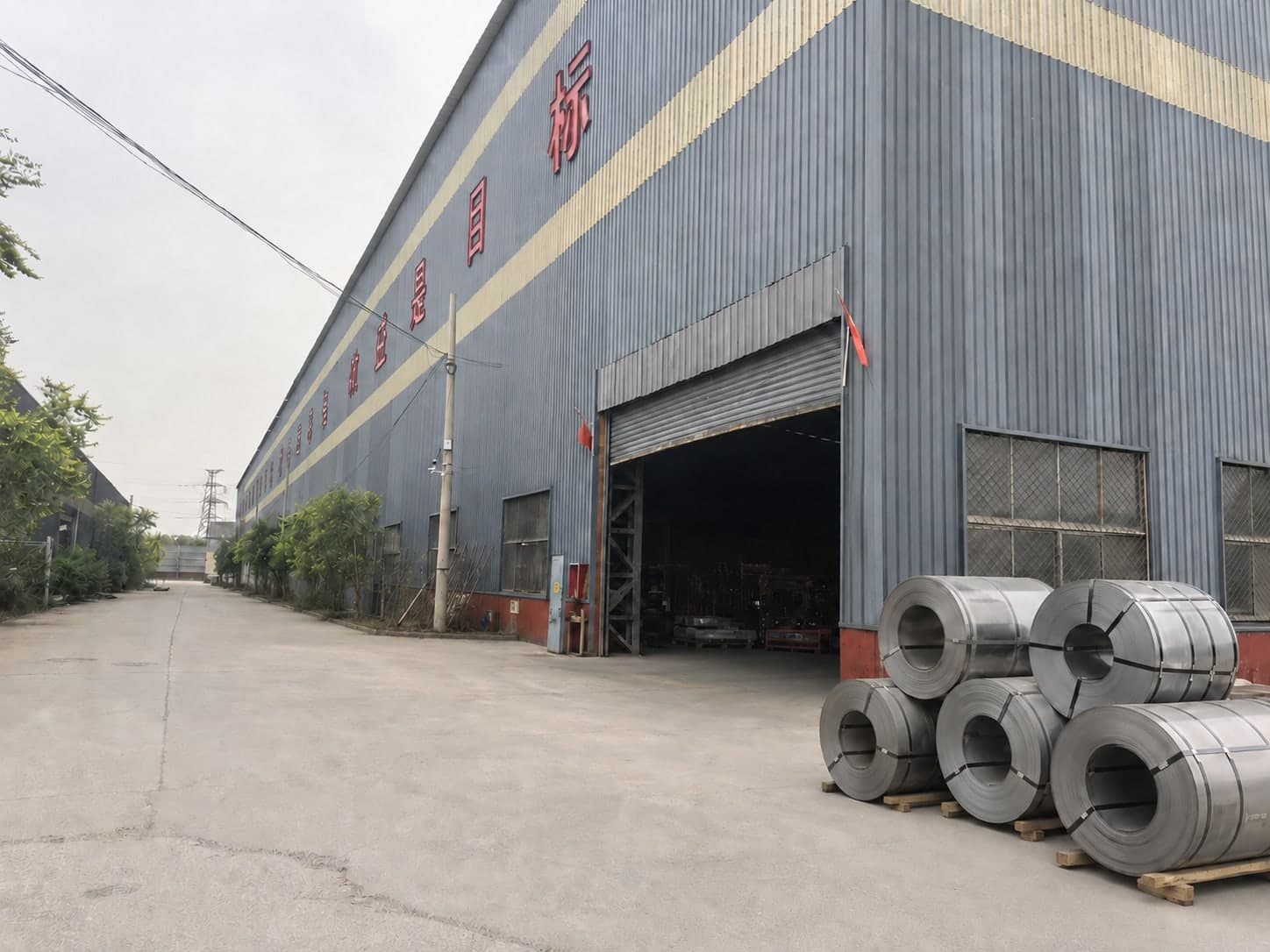 Factory entrance with steel coil materials